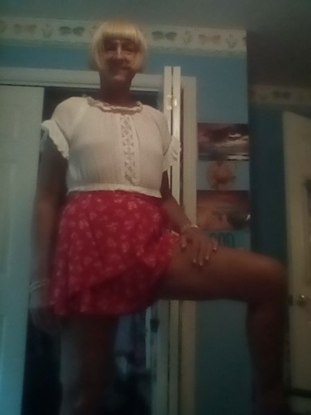 White top with red skirt.