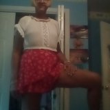 White top with red skirt.