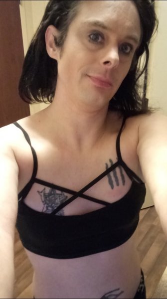 Lounging around in my sexy black sports bra!