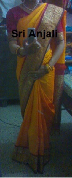 Sri Anjali in yellow silk saree