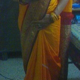 Sri Anjali in yellow silk saree