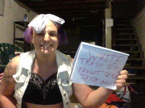 sissypansy weakling smiling wide with sign for Miss K
