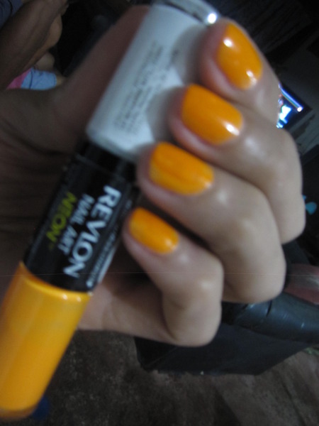 freshly painted nails in high voltage neon orange