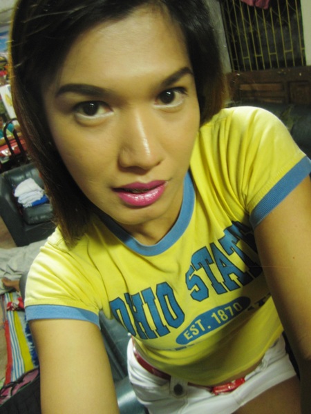 in yellow baby tee and white denim mini-skirt