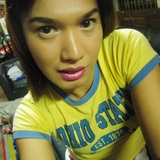 in yellow baby tee and white denim mini-skirt