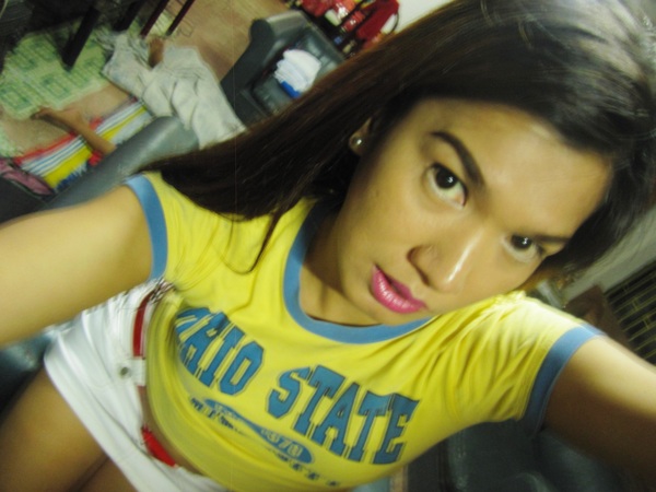 in yellow baby tee and denim mini-skirt